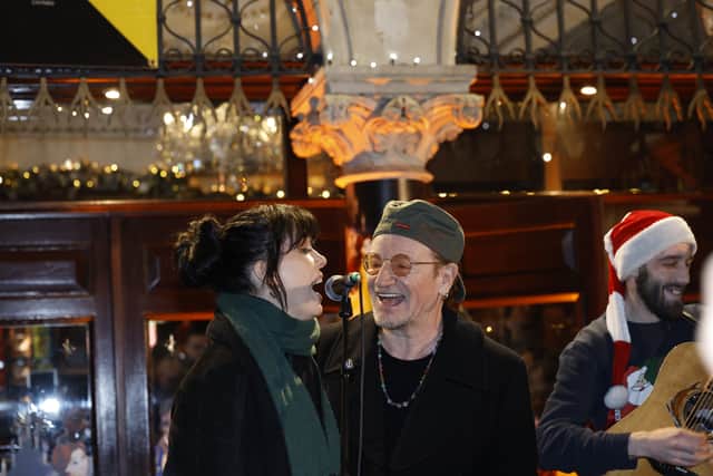 U2 frontman Bono was one of the last to take to the stage, performing a rendition of Christmas (Baby Please Come Home) with singer May.