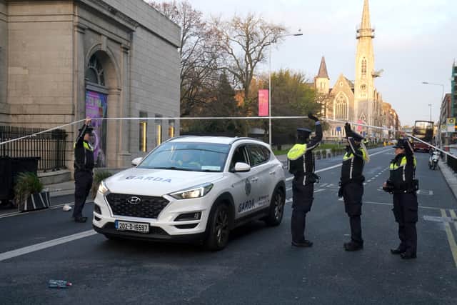 A Garda public order unit was deployed near the crime scene cordon around Parnell Square and O’Connell Street around 6.30pm as protesters started to scuffle with officers and flares and fireworks were thrown at the Garda line.