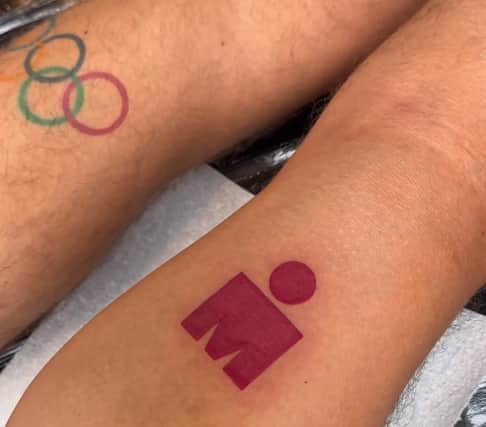 The TV presenter/social media star unveiled his new Ironman logo tattoo on the back of his right calf, having conquered a Spanish triathlon in recent weeks. 