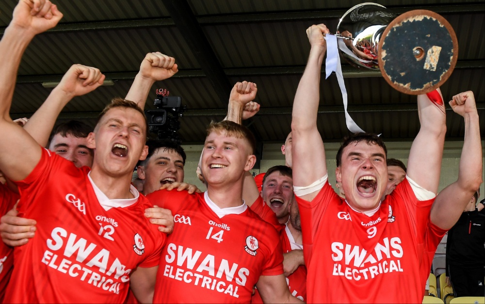 Éire Óg captain Jordan Morrissey lifts the cup as his team-mates celebrate after the Carlow County Senior Club Football Championship final. Photo by Matt Browne/Sportsfile
