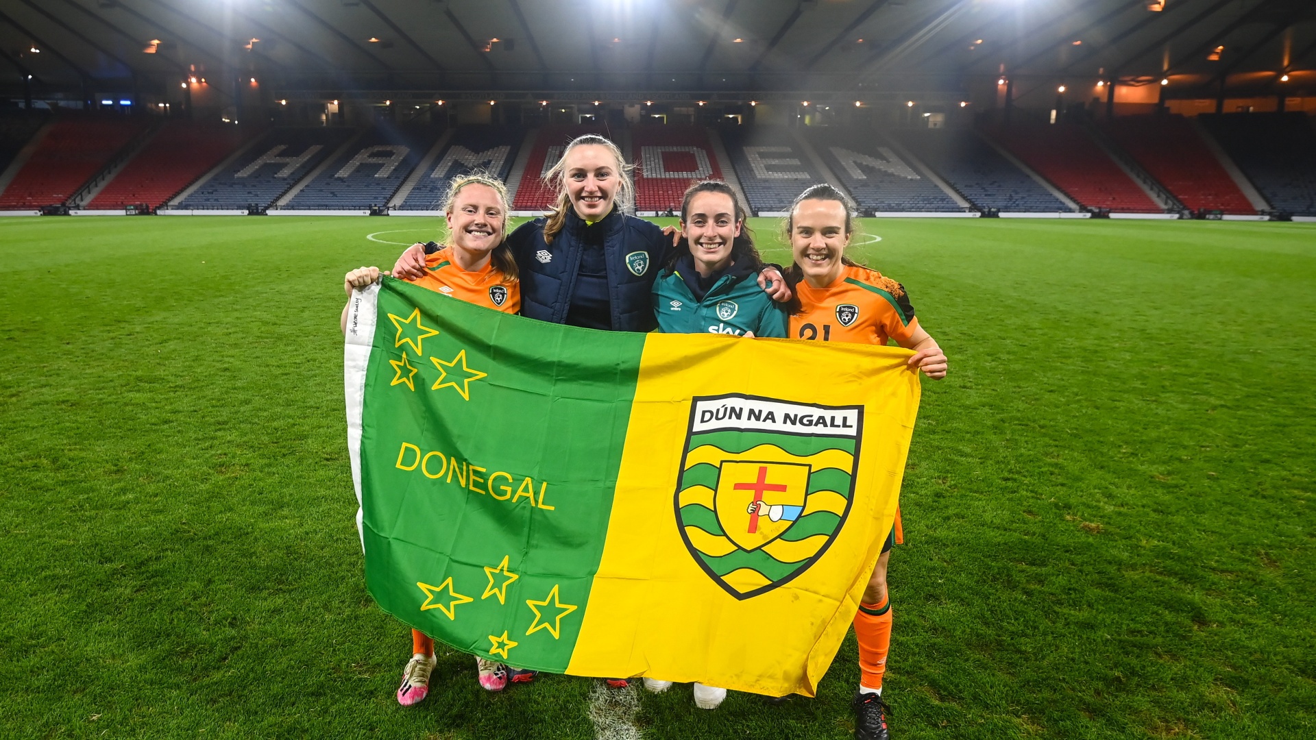 Donegal's Ireland players, from left, Amber Barrett, StatSports technician Niamh McDaid, Roma McLaughlin and Ciara Grant celebrate qualification at Hampden Park