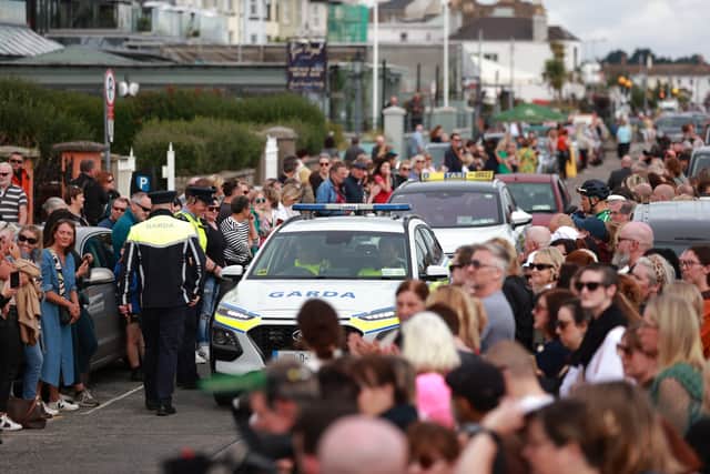 Fans have been gathering outside the former home of the star in Bray, Co Wicklow, before the funeral cortege passes after a private service.