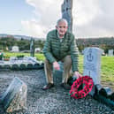 Simon Geoghegan at the grave inTinnahinch of his grandfather, Pte. Martin Geoghegan who died in World War I which he finished renovating on the day of the 100th anniversary of the end of the war