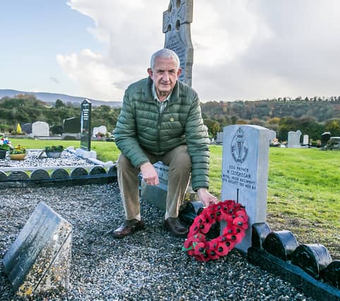 Simon Geoghegan at the grave inTinnahinch of his grandfather, Pte. Martin Geoghegan who died in World War I which he finished renovating on the day of the 100th anniversary of the end of the war