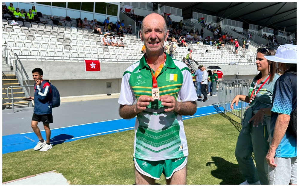 Tony Gartland proudly displays his bronze medal