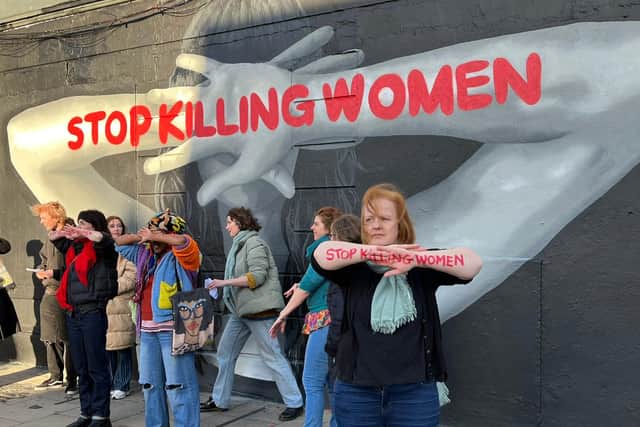 The mural, created by street artist Emmalene Blake, shows a woman appearing to defend herself with the words “Stop Killing Women” written across her arms.