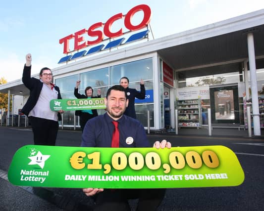 Staff at the Tesco store in Newcastle West in Co. Limerick celebrate after it was confirmed that they sold the winning ticket for Daily Million top prize of €1 million