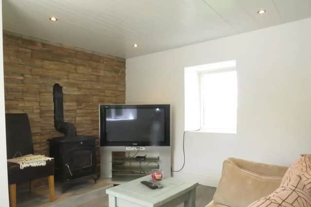 The property comprises of a hallway, sitting room and kitchen on the ground floor while the first floor holds two bedrooms and the bathroom.