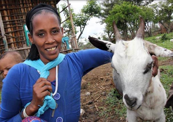 35 year old Ethiopian mum Mula Bedis is pictured with her newly received goat, which she received as part of a livestock programme supported by Self Help Africa.