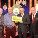 Denis Cassin receiving his cheque