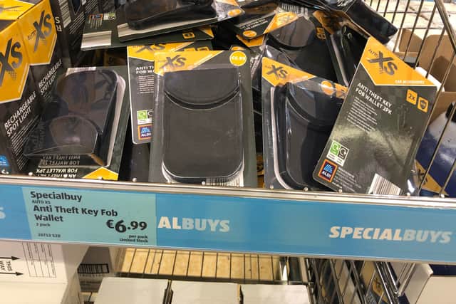 The wallet has fabric with metal woven into it to scramble signal frequencies of the key fobs.