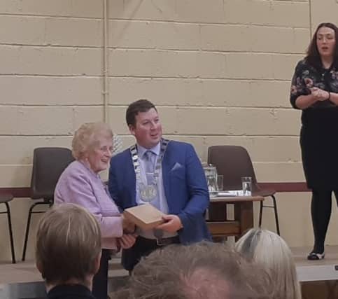 Anna May McHugh presented with a gift at the Ballon Community Centre and pictured with Cathaoirleach of Carlow County Council, Brian O'Donoghue