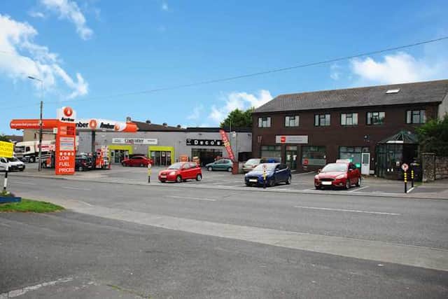 The half-acre site (pictured below) includes a convenience store and forecourt with petrol pumps trading as Amber; a take-away unit; 5 x apartments, and an office unit let to the OPW.
