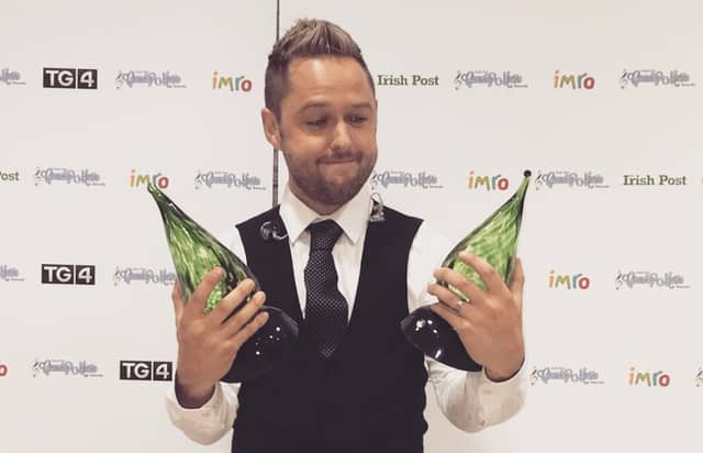 Derek Ryan with his awards
