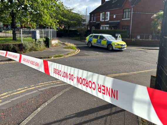 A police cordon at the scene of the stabbing outside apartments in the Kinnaird Avenue area of north Belfast