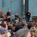 U2 during a performance in front of students from their old school in Dublin