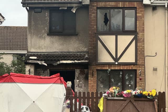 Floral tributes at a house in Birchwood, Waterford (Mícheál Ó Scannáil/PA)