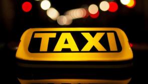 Taxi window smashed and car riffled through in Carlow