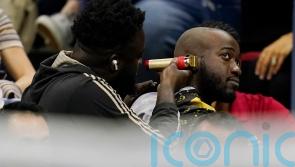 Fans removed from sports event for having a haircut in the stands