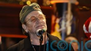 Bono joins annual Dublin city centre Christmas Eve busking session