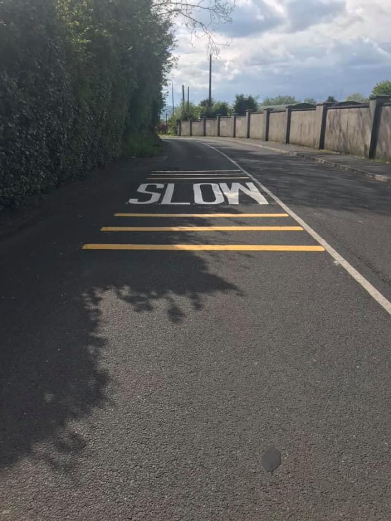 'Slow' road markings painted onto Brownshill Road as part of traffic