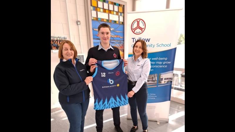 Carlow owned present local Carlow school with new basketball jerseys 