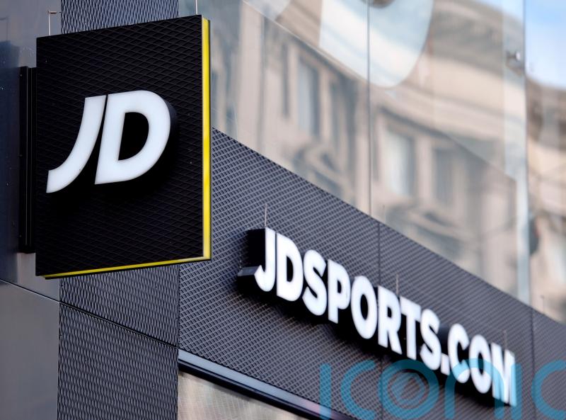 Popular sportswear company posts record profits but warns economic woes will hold back growth