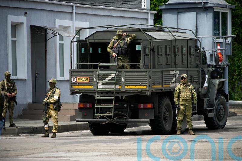 Ukraine cautious as Russia begins retreat from key city