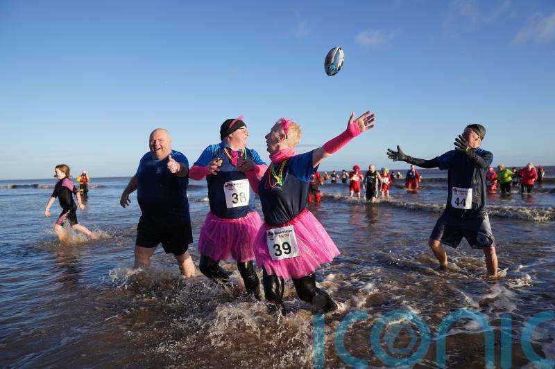 In Pictures: Revellers take the plunge with New Year’s Day dip in icy waters