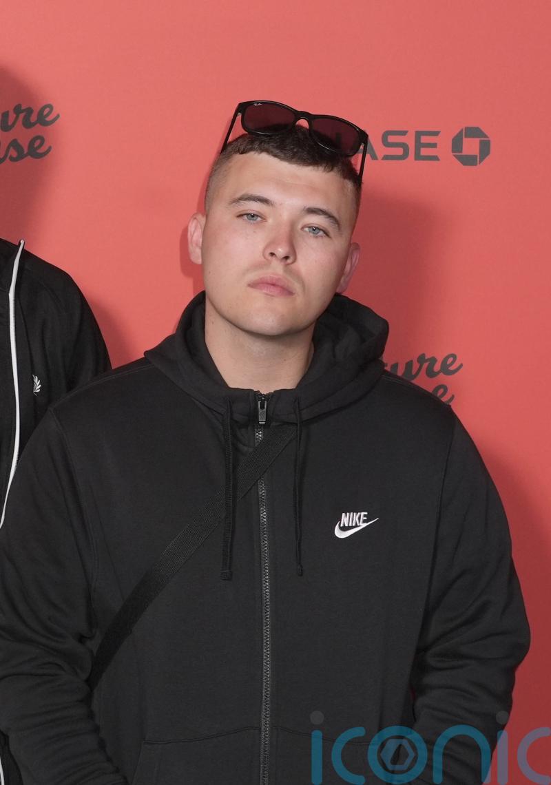Star of rap group Kneecap charged with terrorism offence over Hezbollah flag