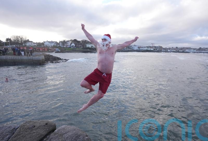 Crowds brave chilly temperatures for Christmas Day swim
